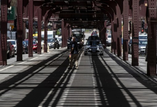 Shadows of the “L” tracks and CTA platforms overhead cover Wabash Avenue in the Loop on Wednesday. Many of Chicago’s downtown elevated tracks were built around the turn of the last century. (Brian Cassella/Chicago Tribune )
